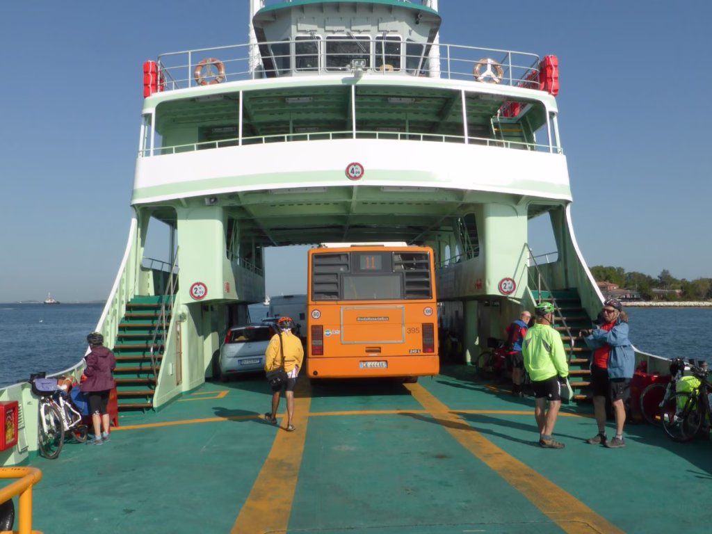 Cyclists on ferry from the Lido to Venice in Italy