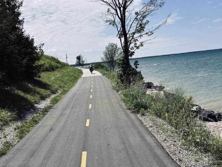 Cyclist on Great Lakes Waterfront Trail near Port Elgin, Ontario